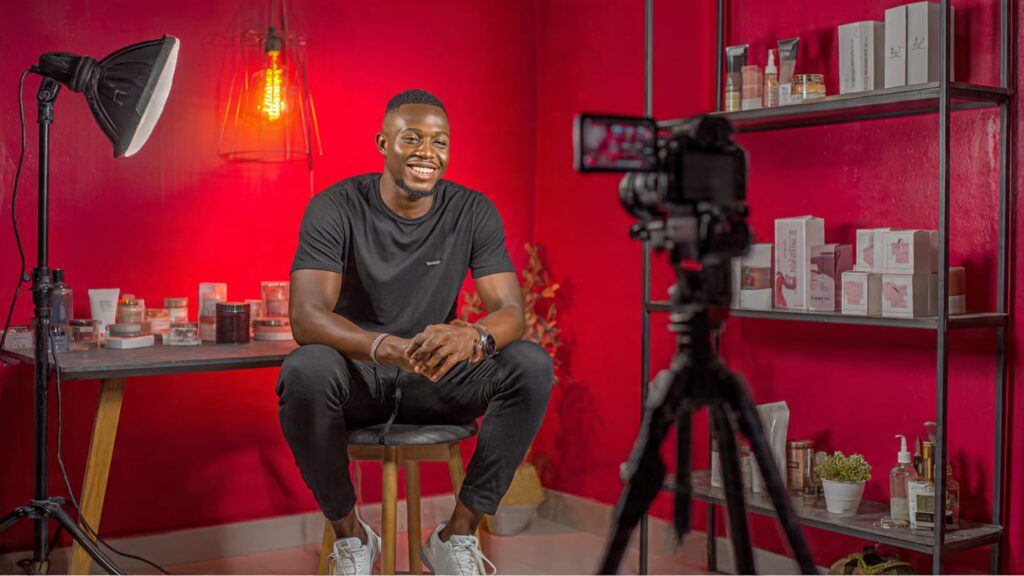 Nigerian entrepreneur creating Instagram Reels content in Lagos workspace