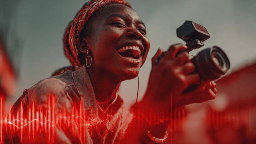 Nigerian content creator filming a Reel with trending Afrobeats music in a vibrant setting