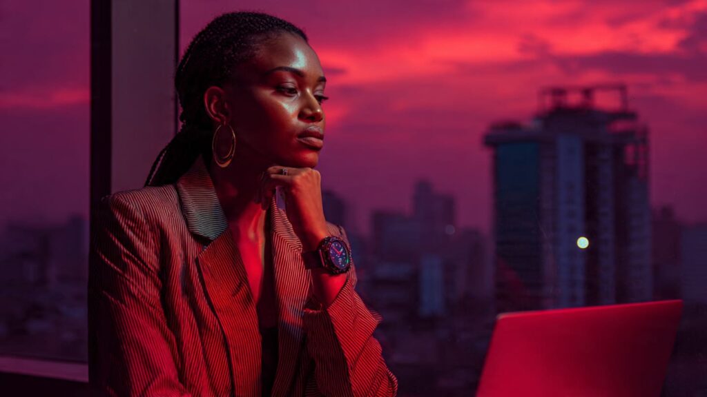 A lifestyle creator in a modern home office checking her watch during the best time for Instagram Live in Nigeria.