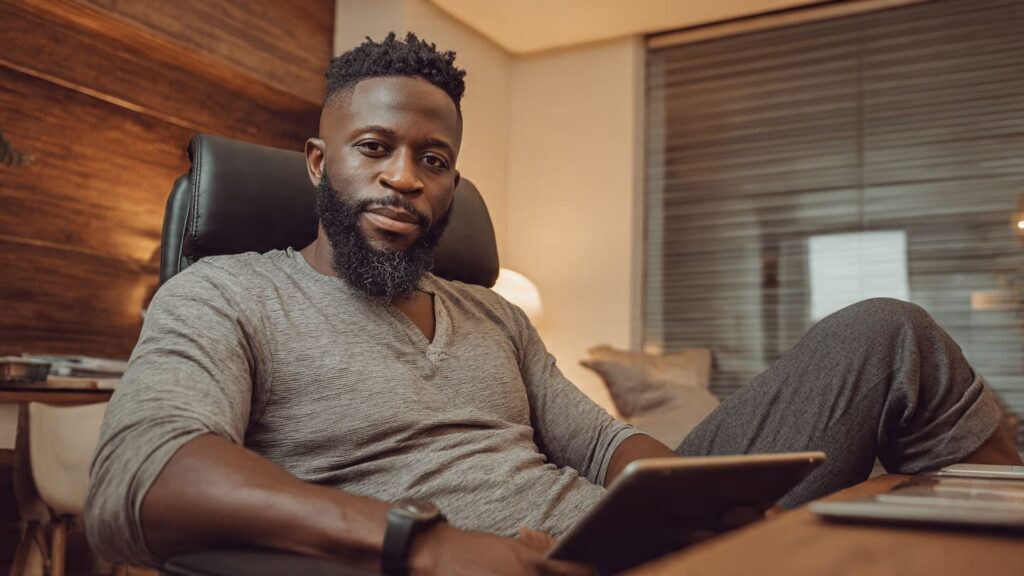 Secure and professional growth environment showing a Nigerian business owner using Sizzle Social growth infrastructure.