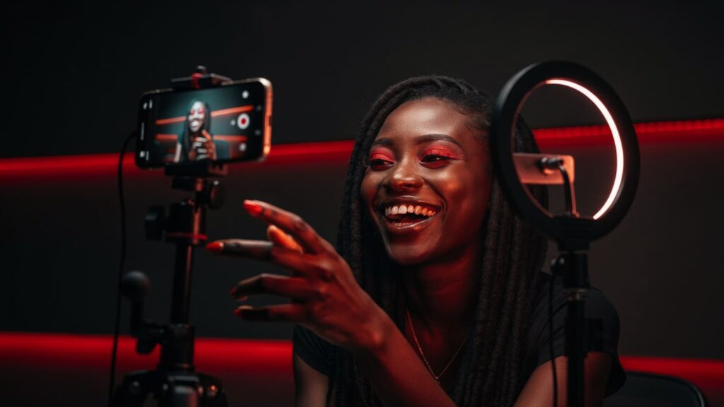 Nigerian creator recording a high-energy Reel to increase Instagram engagement rate in Nigeria.