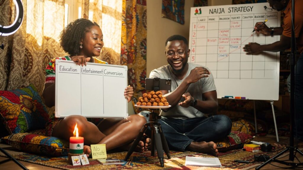 Three Nigerian creators brainstorming Instagram content with education, entertainment, and conversion pillars on a whiteboard in Lagos.