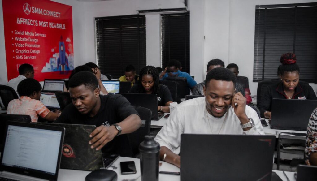 Nigerian buyers reading reviews on laptops