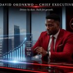 Visual illustration of a Nigerian executive analyzing digital analytics graphs to grow LinkedIn followers organically